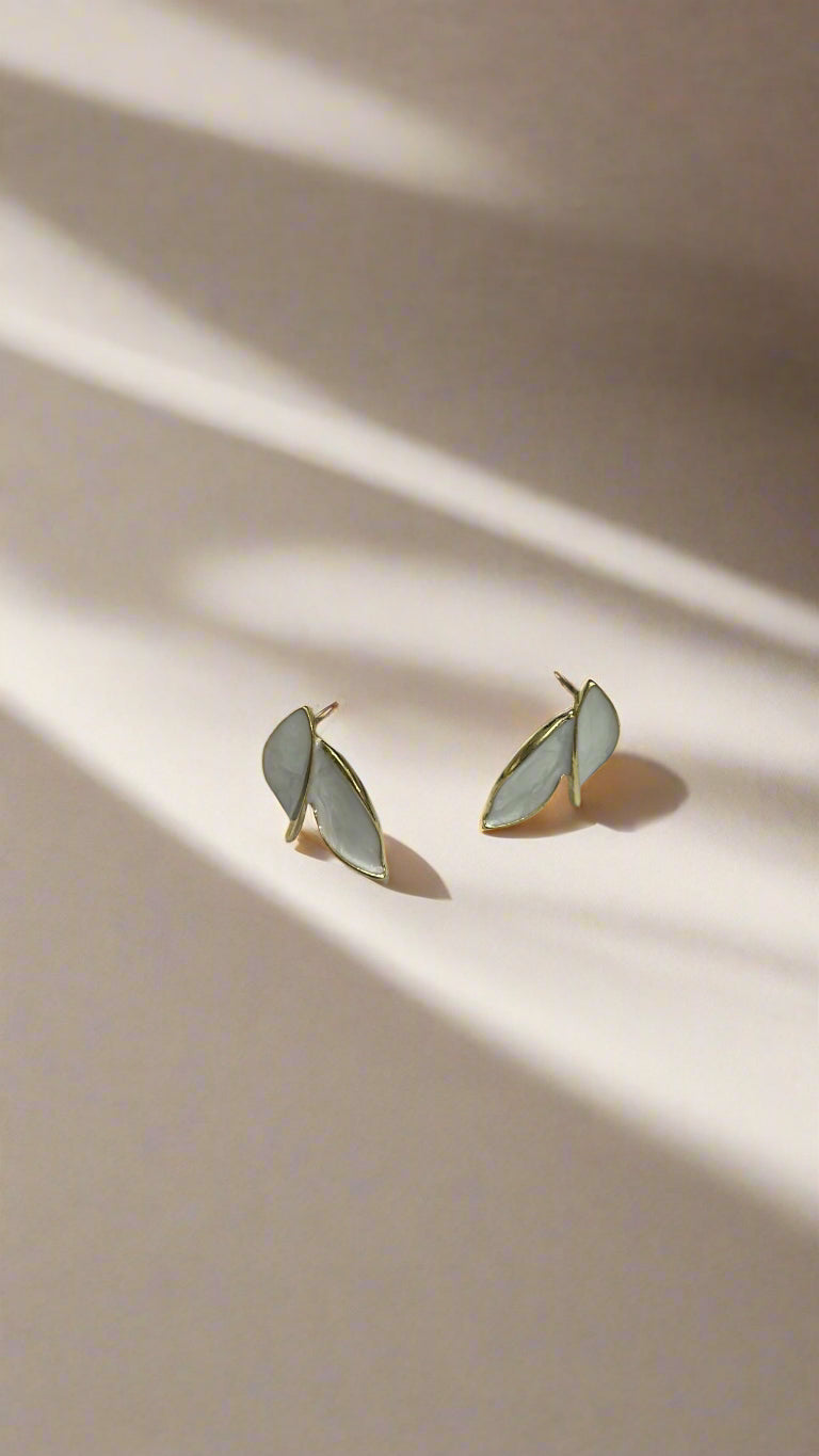 Elegant White Dual Leaf Stud Earrings – Gold Trim