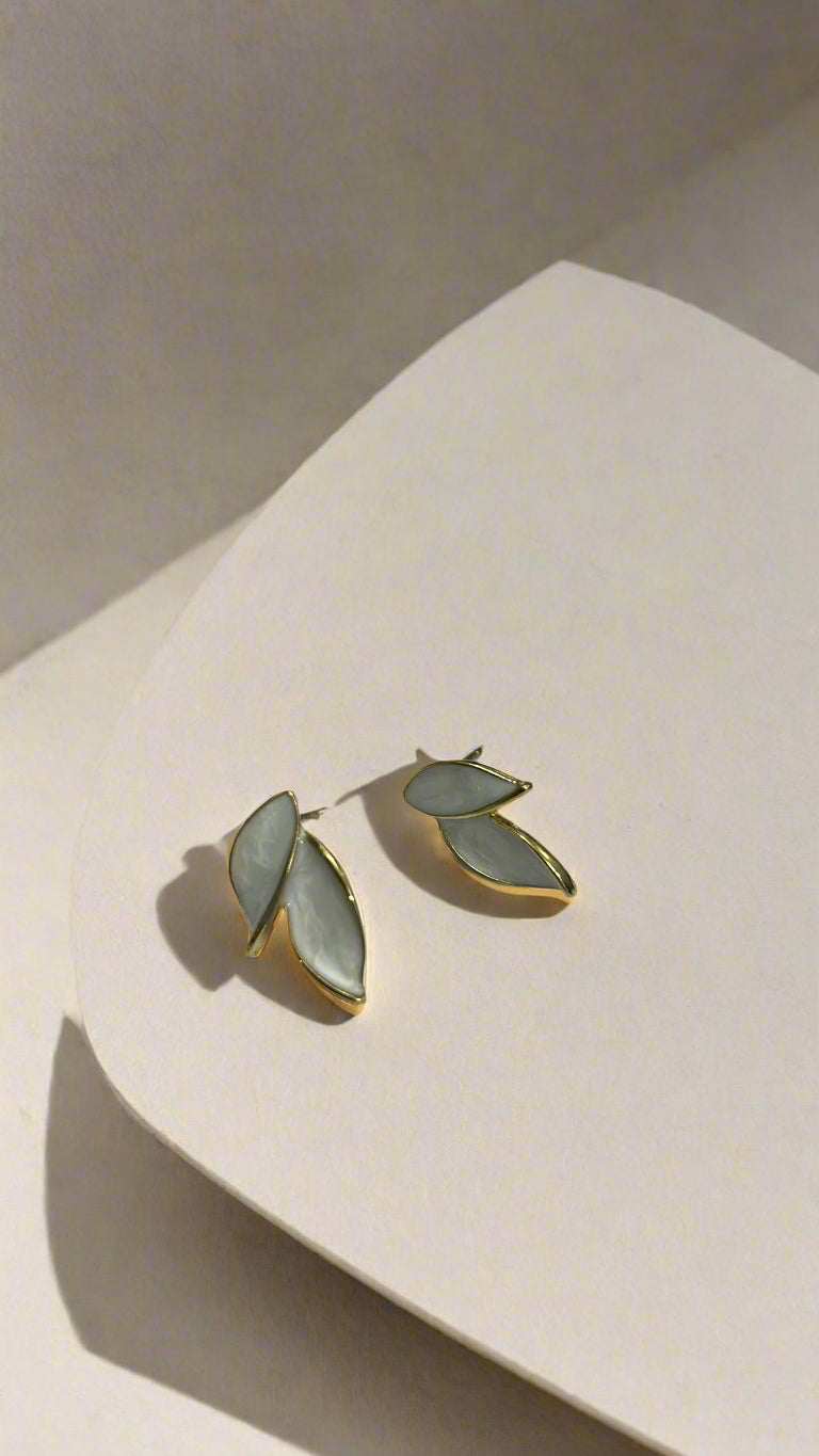 Elegant White Dual Leaf Stud Earrings – Gold Trim