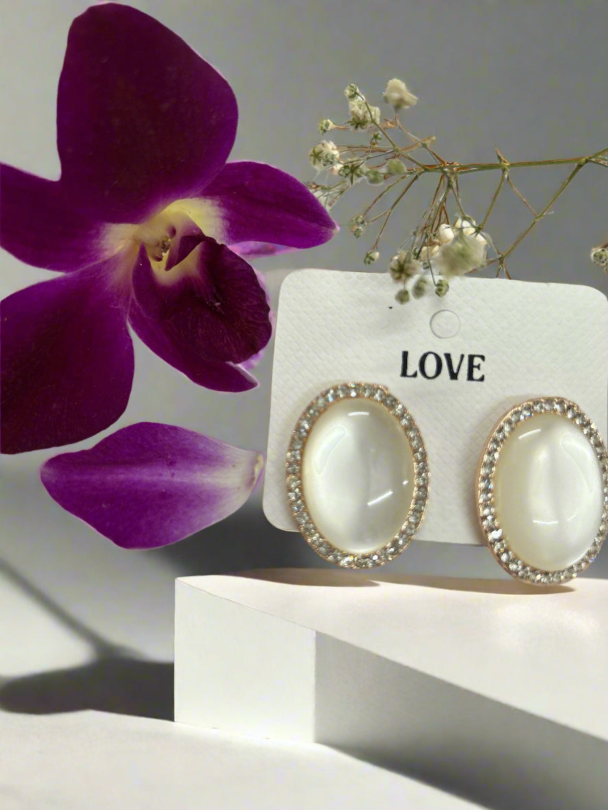 Classic White Oval Stud Earrings – Gold Rim with Diamond Accents
